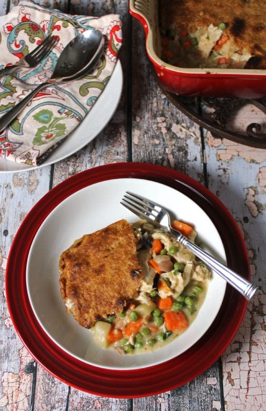 Looking for a Creamy Chicken Pot Pie recipe that isn't full of refined flour? This Chicken Pot Pie with a Whole Wheat Crust has been updated to be a little healthier. But it tastes more like comfort food than anything else that comes out of my kitchen. Double the recipe for an easy freezer meal!!