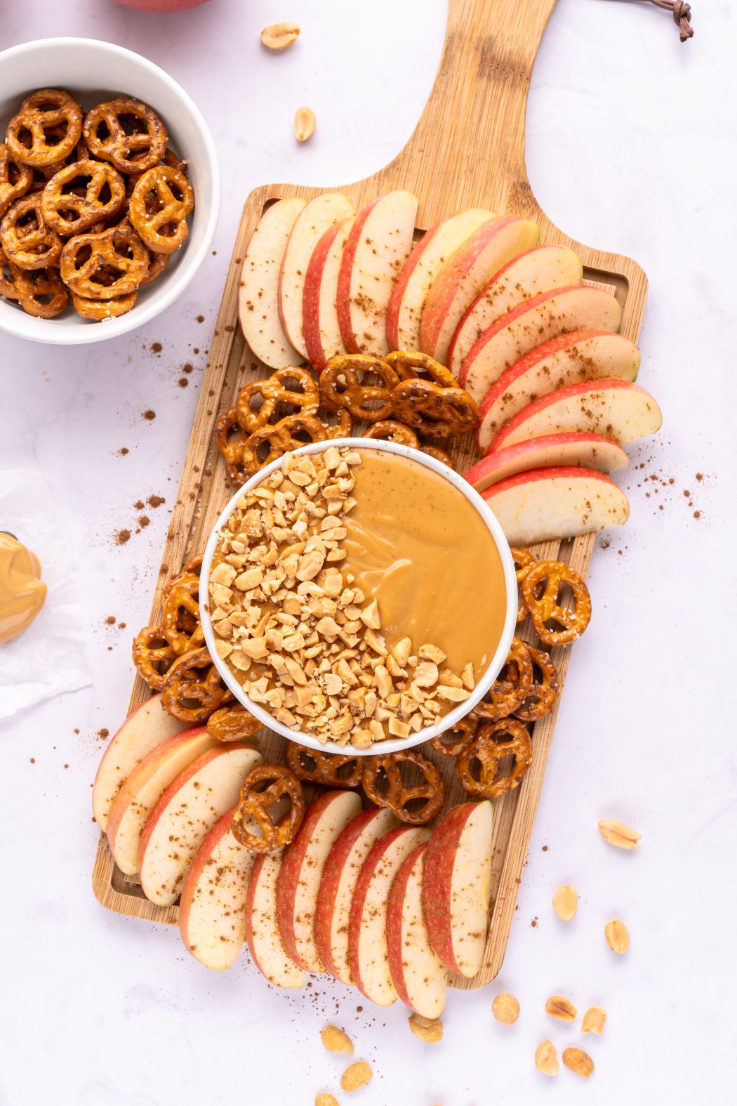 charcuterie board with cream cheese caramel apple dip