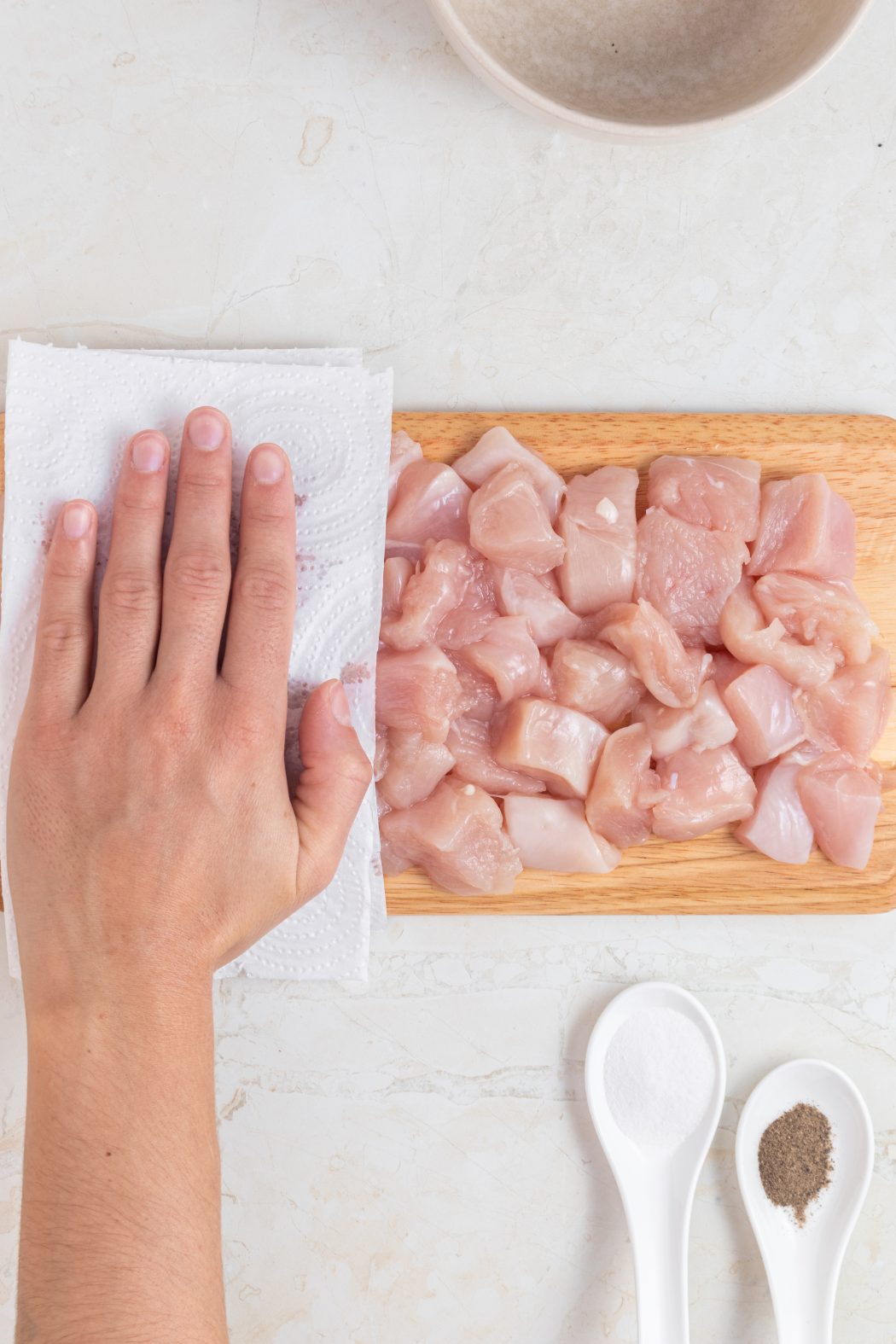 Patting dry chicken for marry-me chicken pasta