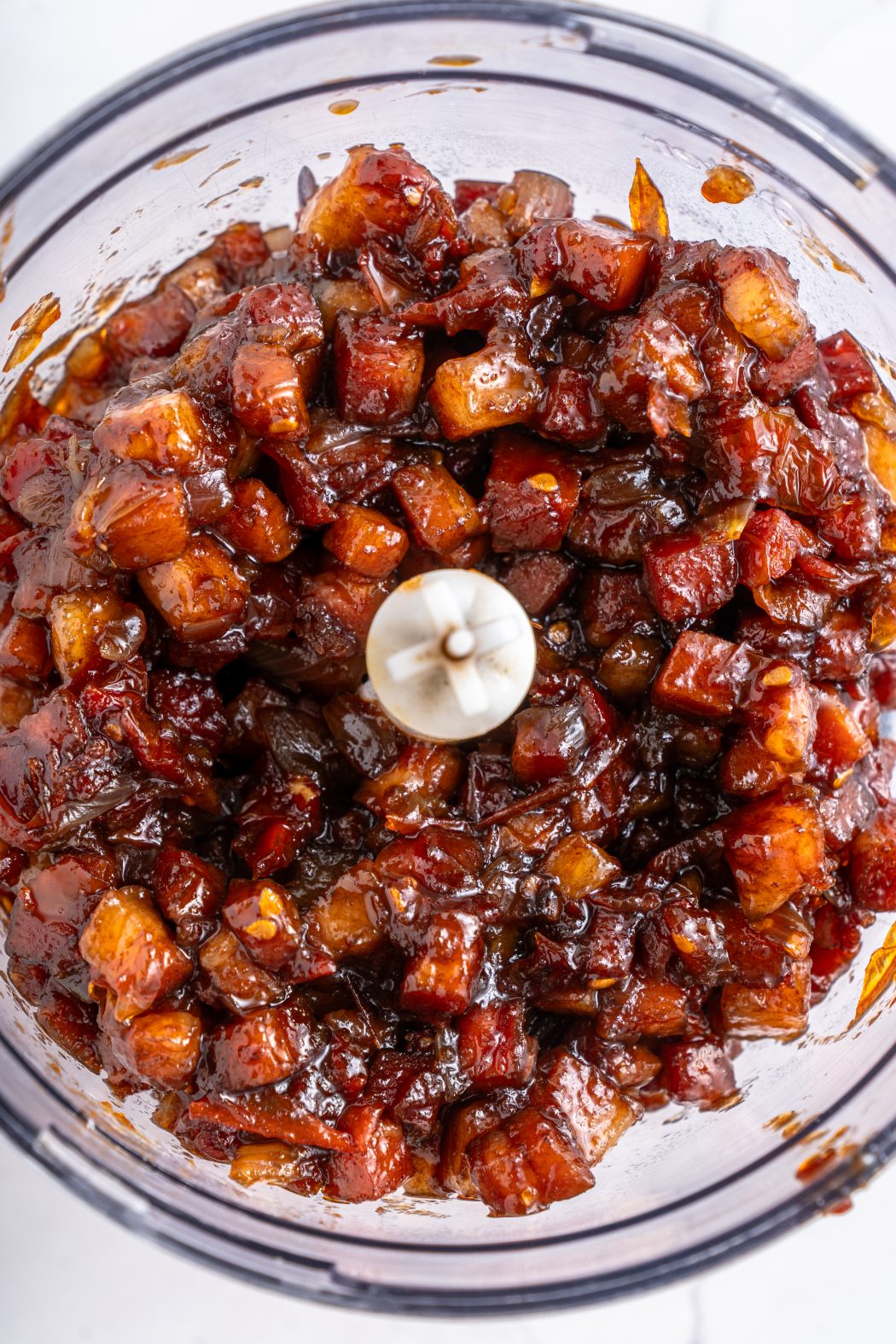 tomato bacon jam ingredients in a food processor