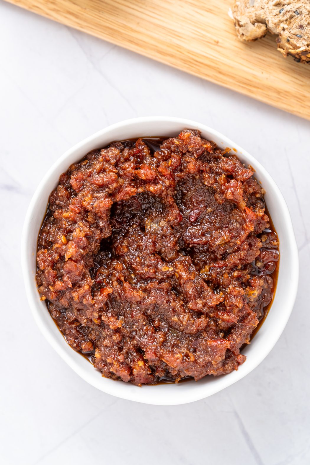 tomato bacon jam in a white bowl