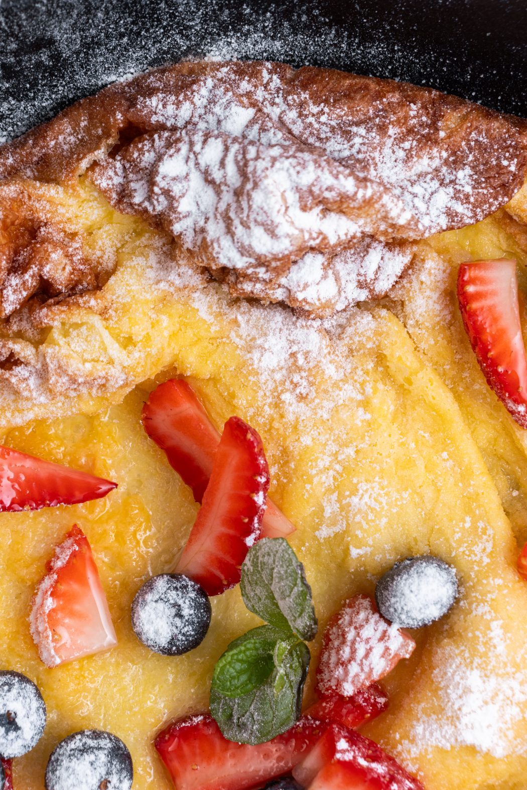 dutch baby pancake with powdered sugar