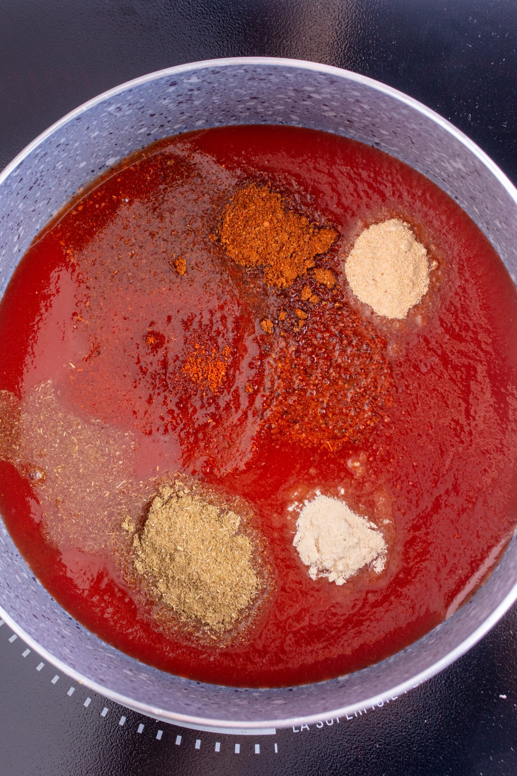 taco sauce simmering in a pan with spices