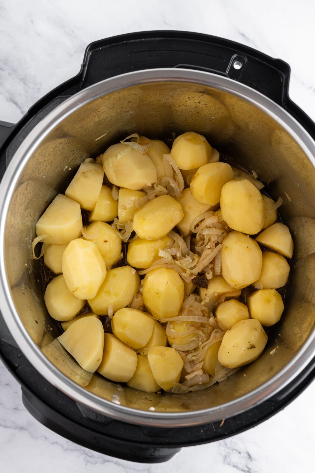 chicken thighs and potatoes inside an instant pot