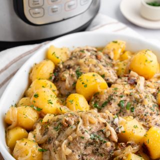 Chicken thighs with potatoes and an instant pot in the background