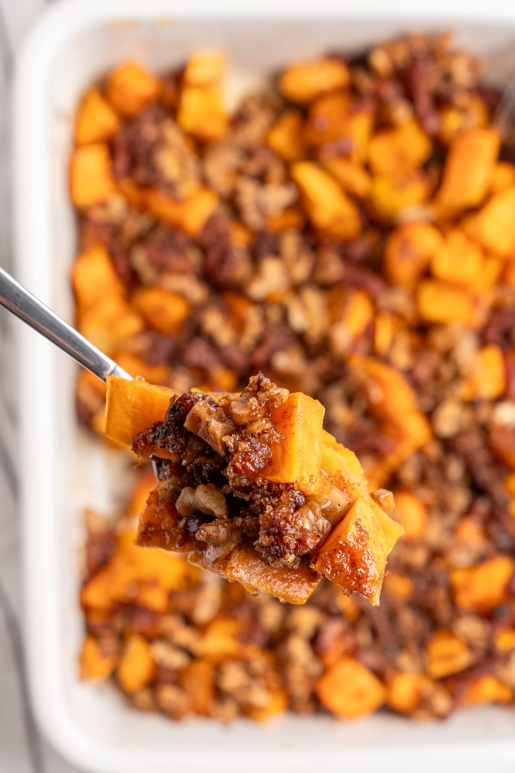 Top view of a spoonful of sweet potato casserole