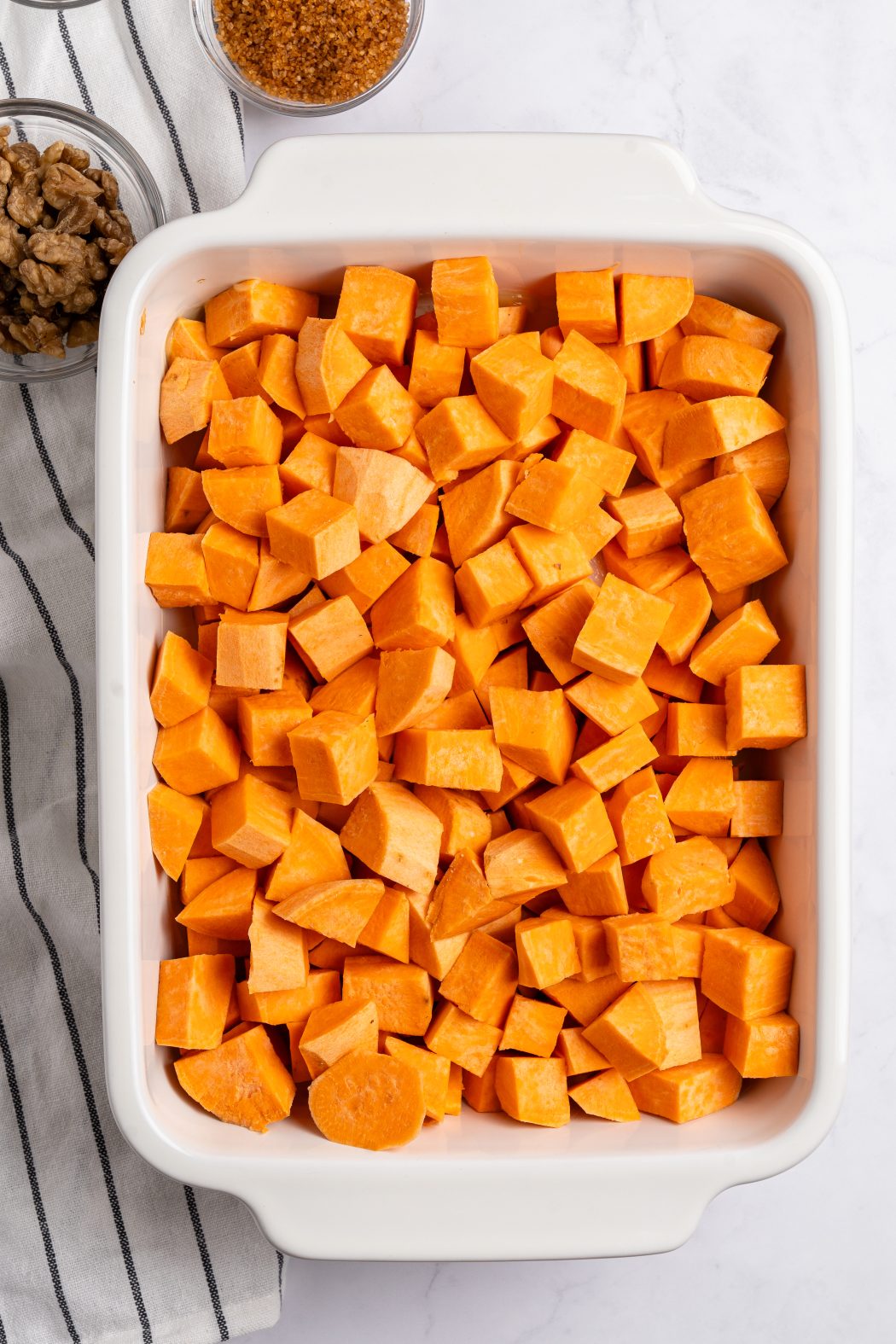 Cubed sweet potatoes in a casserole dish