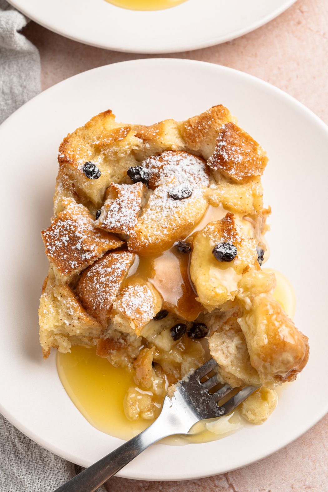 Serving of bread pudding and rum sauce