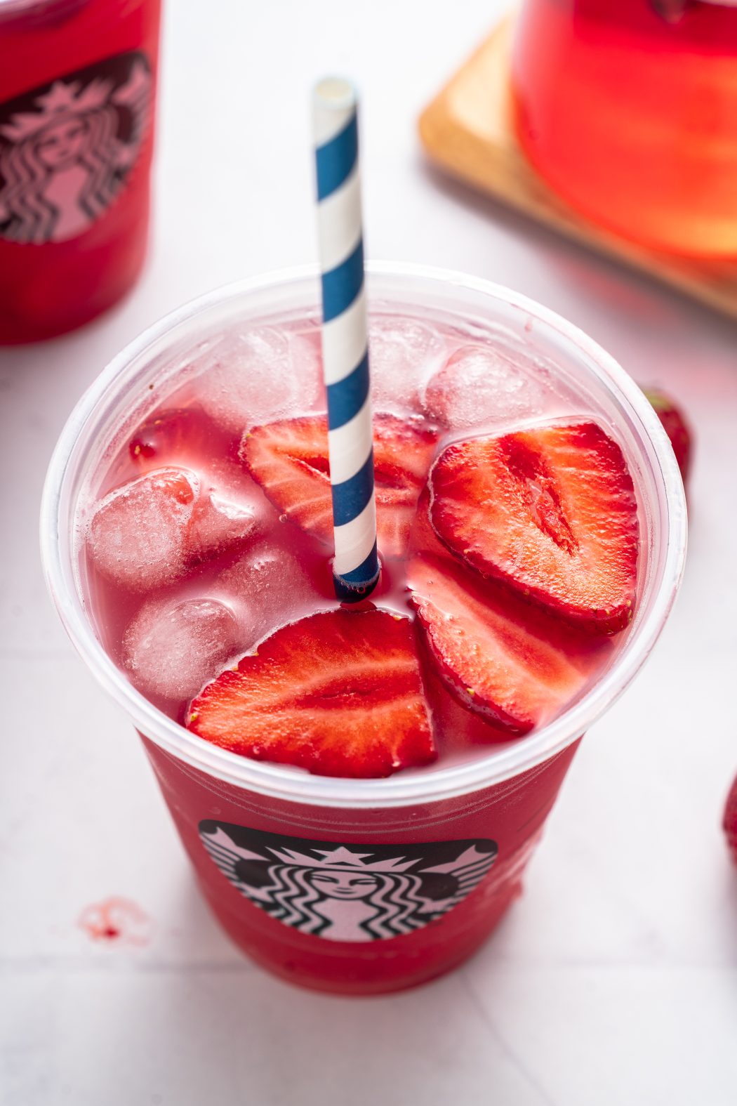 Top view of strawberries and ice cubes in the starbucks refresher